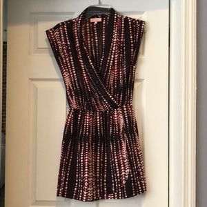 Black and pink faux wrap dress.